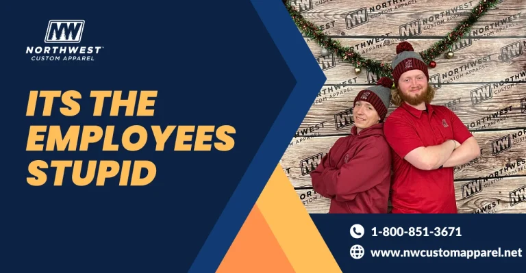 Two employees from Northwest Custom Apparel posing in front of a festive backdrop with company branding, underscoring the value of employees.